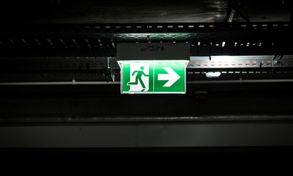 Photoluminescent signs showing exit on the right
